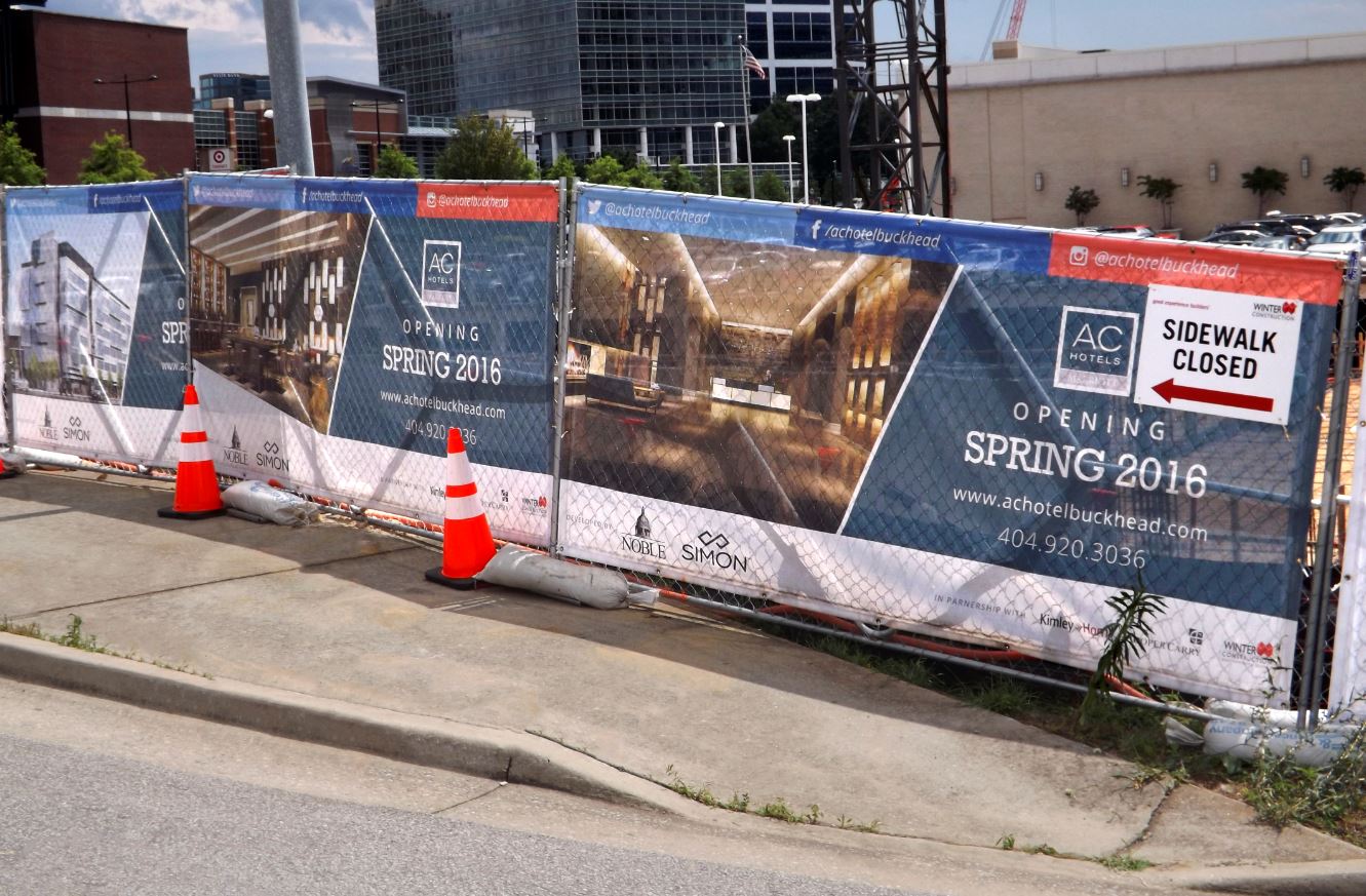 Mesh Banners for Atlanta's Outdoor Events: Why Wind-Through Print Beats Solid Vinyl